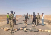 Mutinous troops close a highway in protest over unpaid salaries.