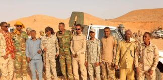 Puntland officers display weapons reportedly seized from PSF forces.