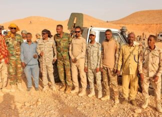 Puntland officers display weapons reportedly seized from PSF forces.